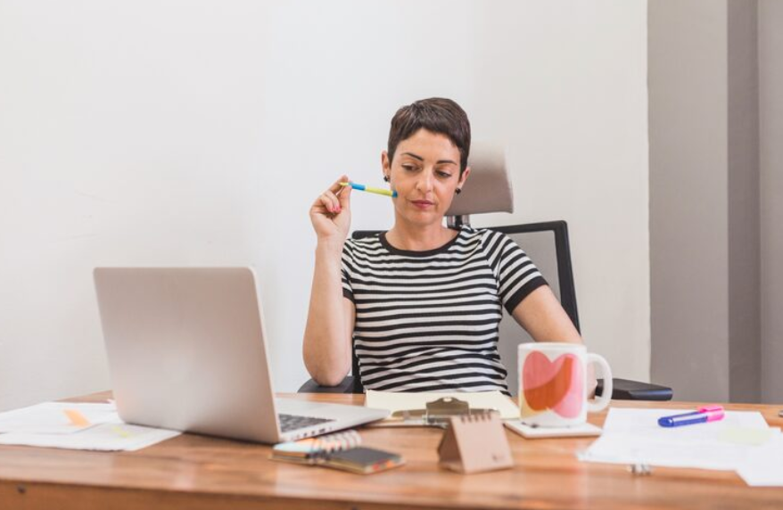 Person sitting at a desk wondering why do I lose motivation while facing unfinished work.