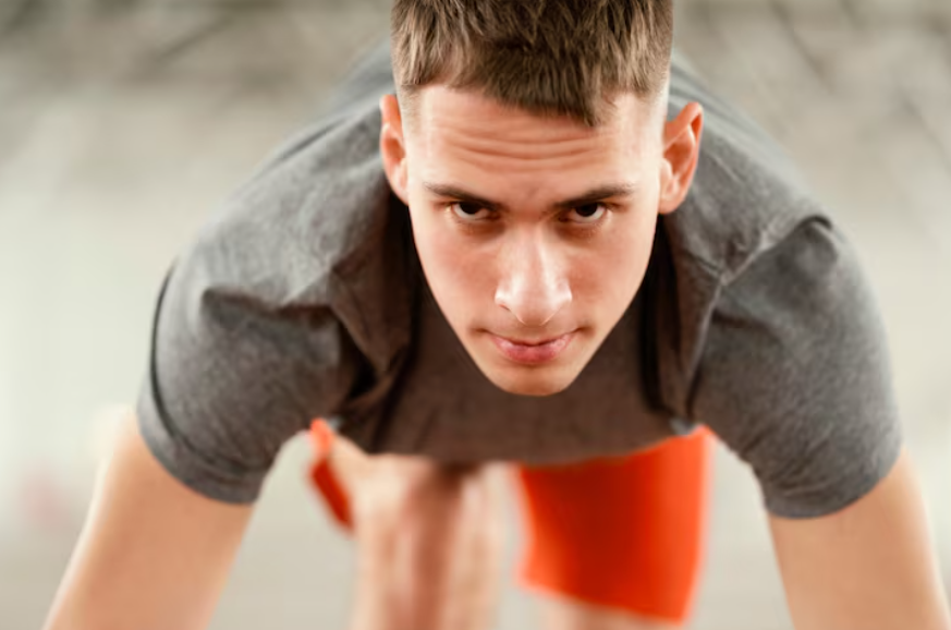 Focused athlete showing why do some people thrive under pressure during high-stakes challenges.