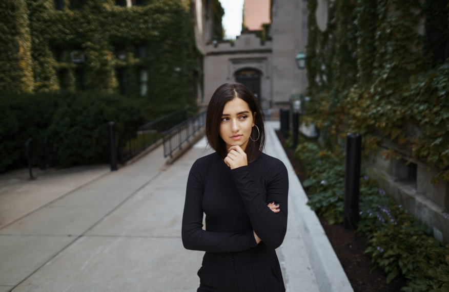 person wondering why does déjà vu happen while standing in a familiar-looking walkway