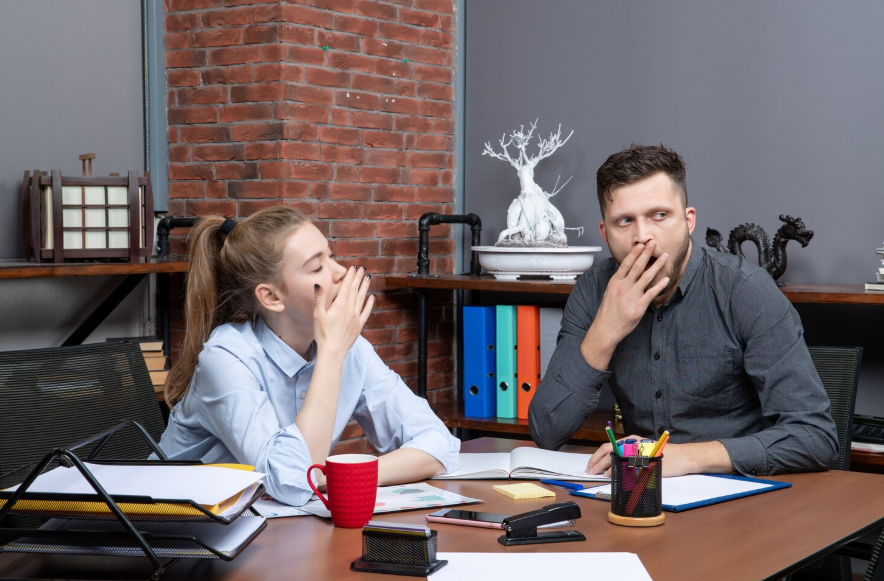 people yawning together in an office showing why are yawns contagious